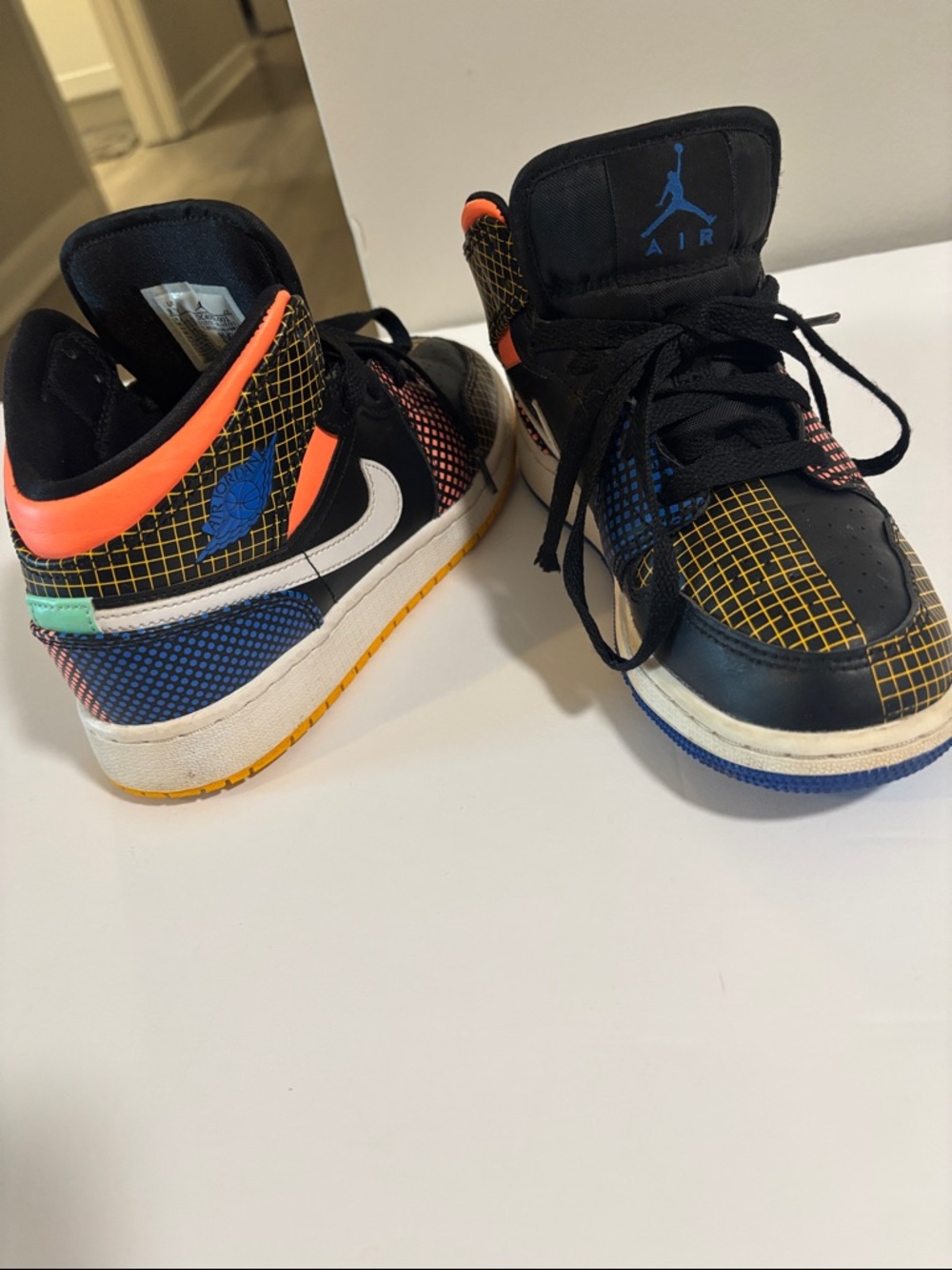 Jordan Kids Black High-Top Sneakers with Yellow, Blue & Orange Grid